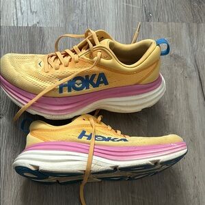 Hoka Yellow and Pink Cushioned Running Shoes with Blue Logo